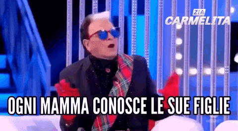 a man wearing sunglasses and a plaid scarf says ogni mamma conosco le sue figlie