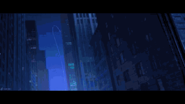 a neon sign that says wooom is lit up at night