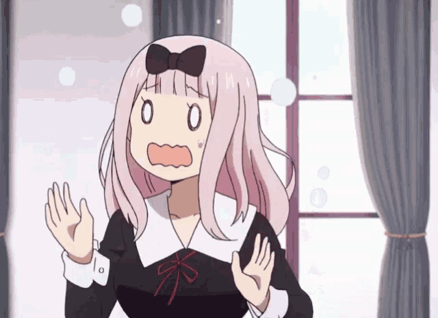 a girl with pink hair has a bow on her head and a surprised look on her face