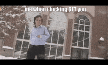 a man dancing in front of a building with the words me when i fucking get you