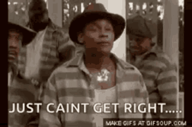 a man in a hat is standing in front of a group of men and says `` just caint get right '' .