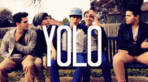 a group of young men sitting on a bench with the word yolo on the bottom right