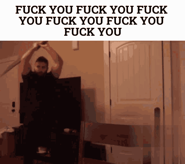 a man standing in front of a tv with his arms in the air and the words fuck you fuck you fuck you fuck you fuck you