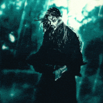 a man with long hair is holding a sword in his hand