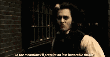 a man in a top hat is talking to another man in a dark room .