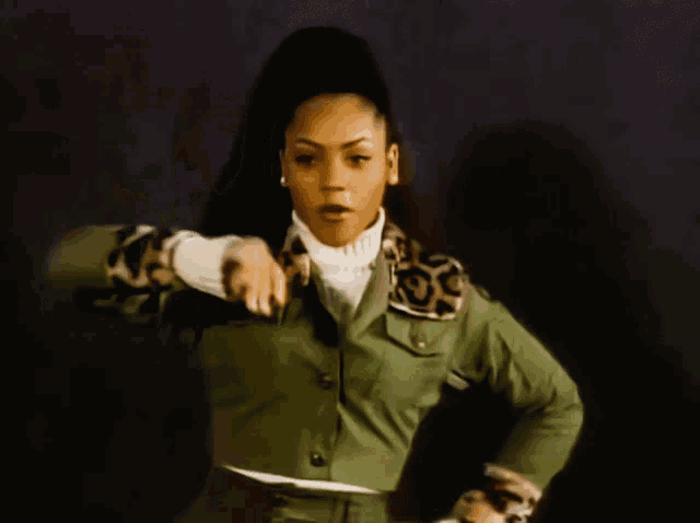 a woman in a green jacket with a leopard print collar and sleeves