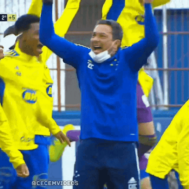 a soccer player wearing a mask celebrates with his team