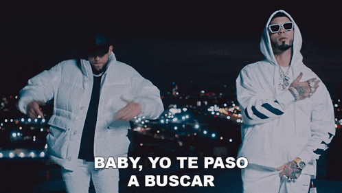 a couple of men are standing next to each other and the words baby yo te paso a buscar are on the bottom