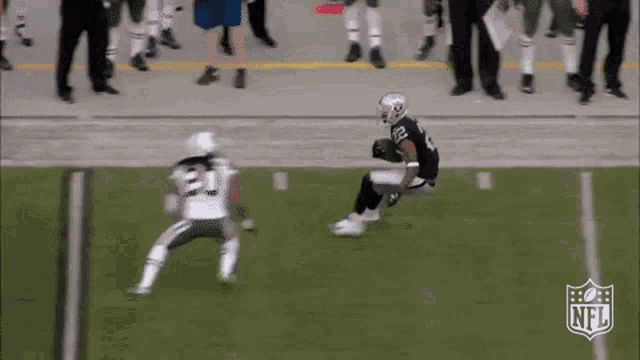 two nfl players are playing a game on the field