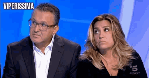 a man and a woman are sitting next to each other on a blue background with the words viperissima above them .