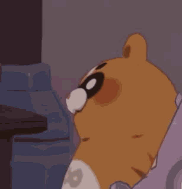 a cartoon dog with a mask on its face is sitting on a couch .