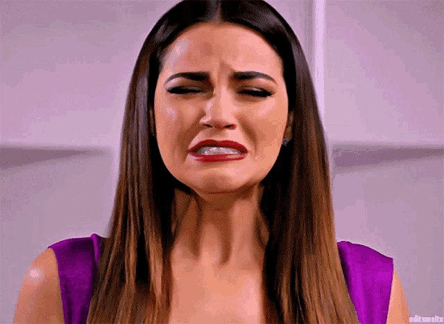a woman in a purple top is crying with editsmalte written on the bottom