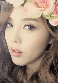 a woman wearing a flower crown on her head