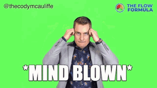 a man in a suit is blowing his mind with the words mind blown