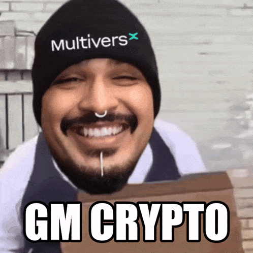 a man with a beard wearing a beanie that says ' multivers ' on it