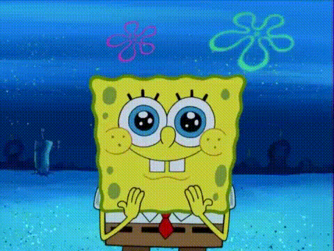 spongebob squarepants is sitting on a table with his hands folded in front of him .