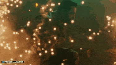 a man is surrounded by sparks and smoke with the hashtag pranay_varma on the bottom