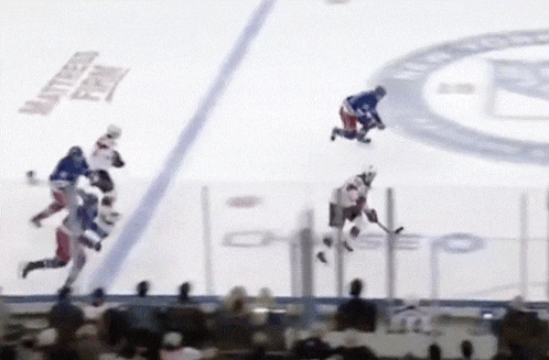 a hockey game is being played on a rink with a northern farm logo on the ice