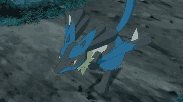 a blue and black pokemon with the letter a on its back