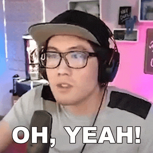 a man wearing glasses and headphones says " oh yeah "