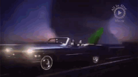 a convertible car is driving down a road with the words all in one show on the bottom