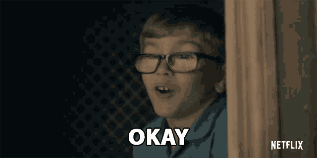 a young boy wearing glasses says " okay " in a netflix ad