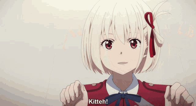 a girl in a red jacket says kitteh