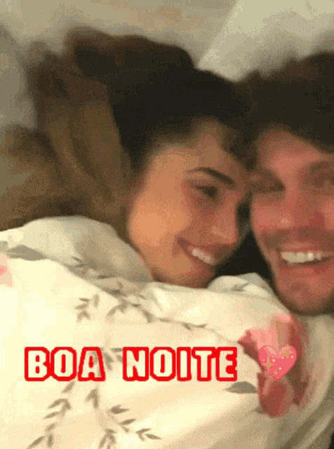 a man and a woman are laying in bed and the words boa noite are above them