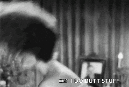 a black and white photo of a woman saying `` me ? i do butt stuff '' in front of a mirror .