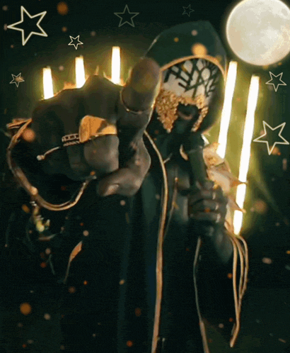 a man with a mask on his face is holding a microphone and pointing