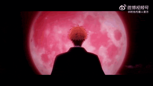 a man in a suit is standing in front of a red moon .