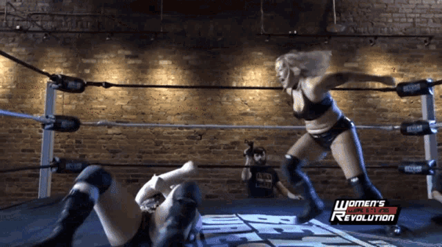 a woman in a wrestling ring with the words women 's wrestling revolution on the bottom
