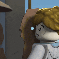 a close up of a lego figure with blonde hair and a white shirt