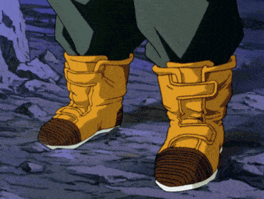 a person wearing a pair of boots with a buckle on the side