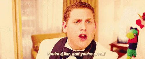 a man in a tuxedo and bow tie is saying you 're a liar and you 're mean .