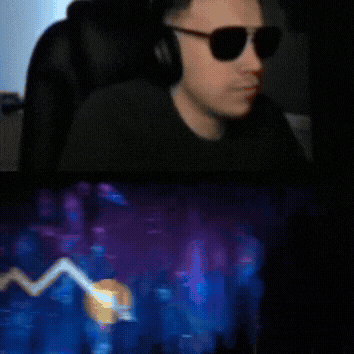 a man wearing sunglasses and headphones sits in a chair