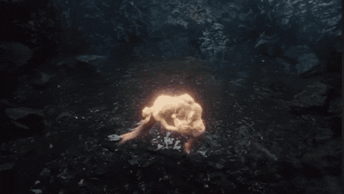 a woman with long hair is swimming in the water