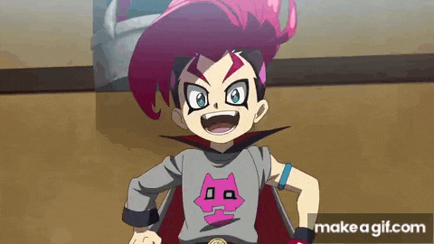 a boy with pink hair is wearing a gray shirt with a cat on it and a cape .