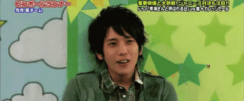a man in a green plaid shirt is smiling in front of a speech bubble that says ping ball runner