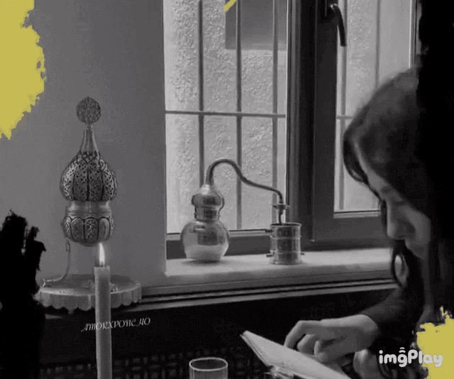 a black and white photo of a woman reading a book with imgplay written on the bottom