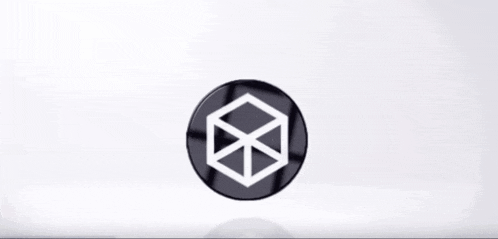 a black circle with a white cube inside of it on a white background