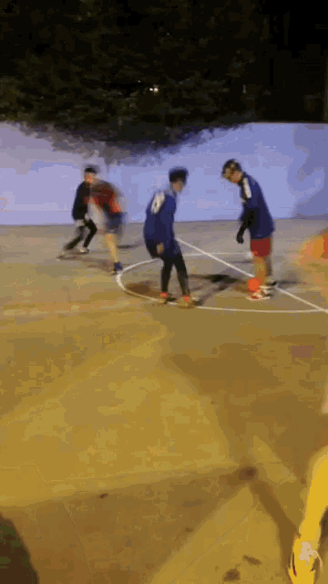 a man in a blue jersey with the number 8 on it is playing basketball
