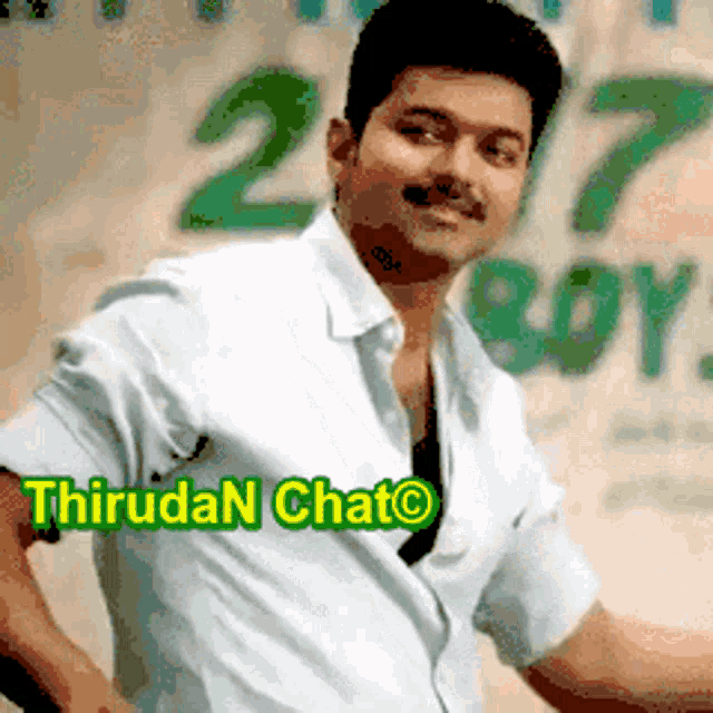 a man in a white shirt is standing in front of a sign that says ' thiruda n chat '