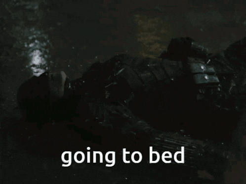 a person is laying on the ground with the words going to bed above them