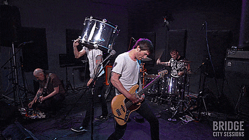a bridge city sessions poster with a band on stage