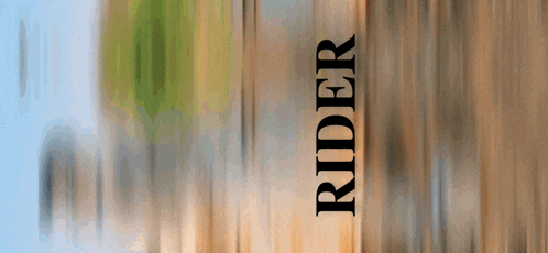 the word rider that is on a wooden surface