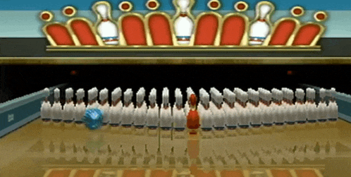 a bowling alley with a lot of pins and a crown on top