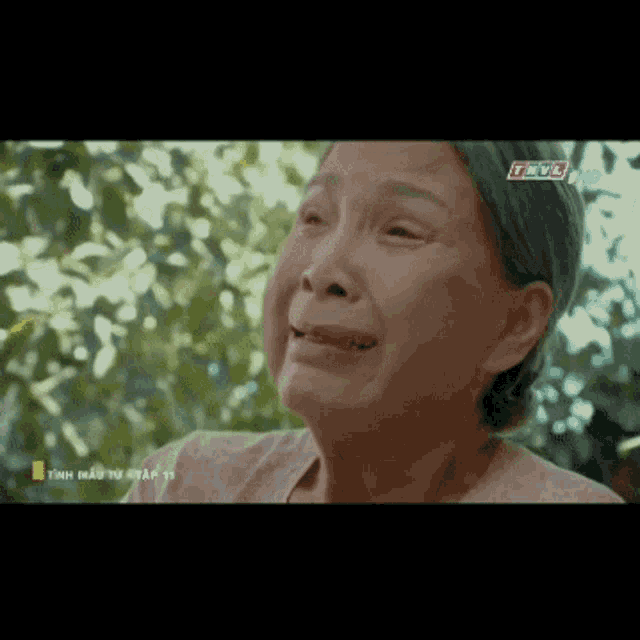 a woman is crying while watching a tv show on thvl hd