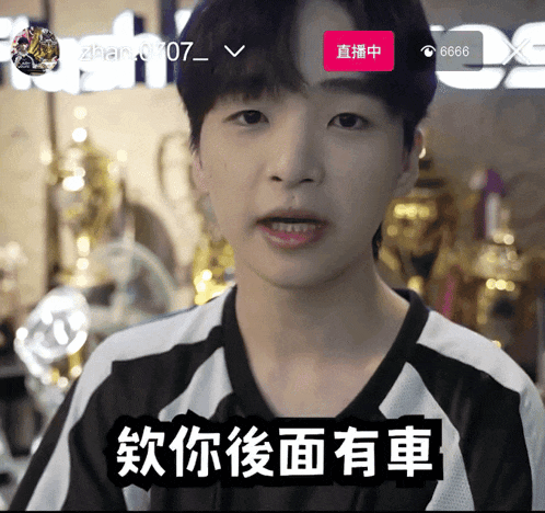 a young man in a black and white jersey says 6666