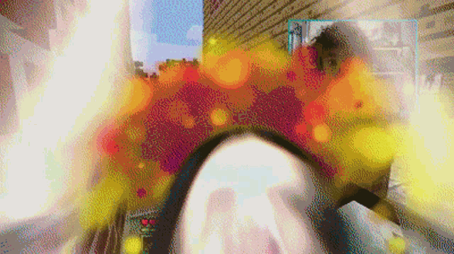 a blurred image of a person 's face with a red heart on the bottom right